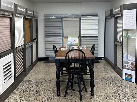 Store interior showcasing several different types of window coverings